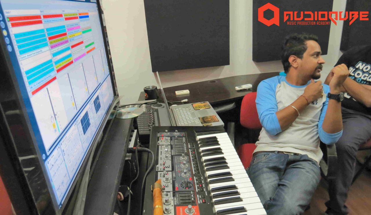 Sound Avtar at a production workstation with a synthesizer during his masterclass